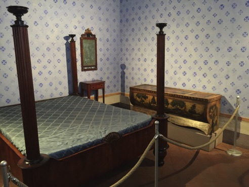 bed on which Puccini was born - love chest in background 