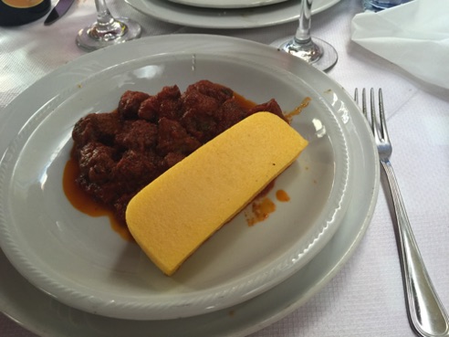 Wild boar with tomato sauce and polenta
