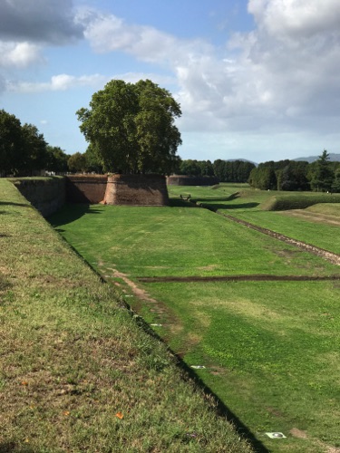 The wall and area outside wall - the wall extended out in places for a military advance in medieval times