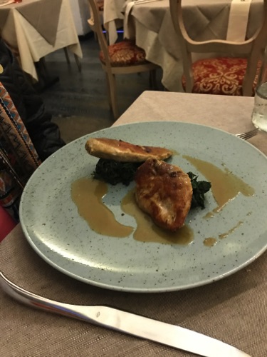 Guinea fowl stuff with porcini mushrooms on spinach