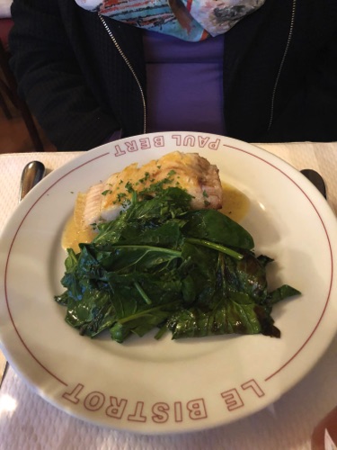 some kind of white fish with some kind of spinach